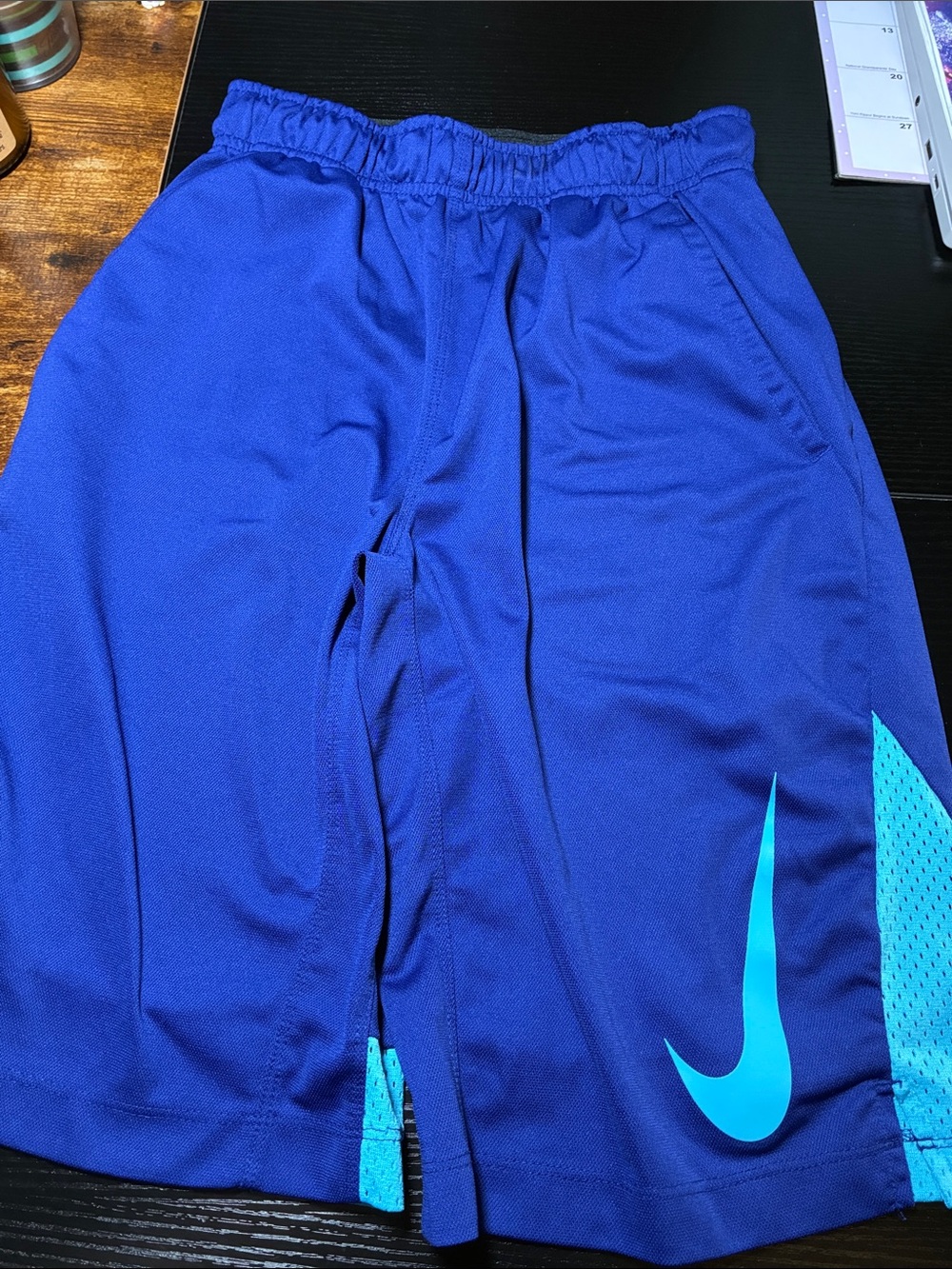 Nike Kids Blue Athletic Shorts with Teal Swoosh Accent